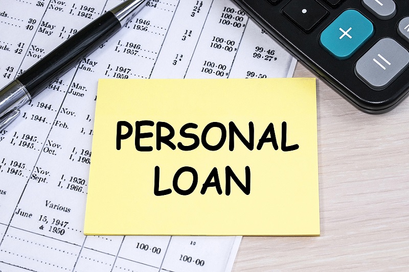 The Inscription Personal Loan On A Yellow Sheet That Lies On The