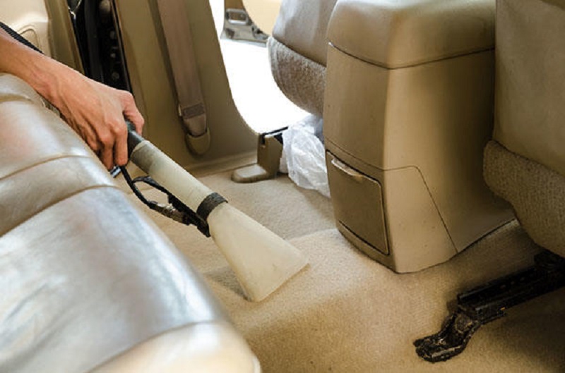 Cleaning automobile floor mats